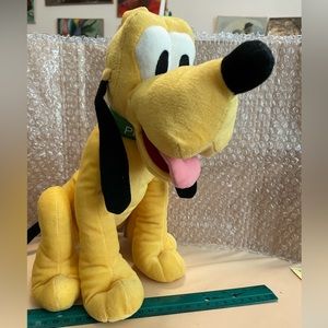 Pluto 12” tall by Just Play L.L.C. He is Mickey’s pet